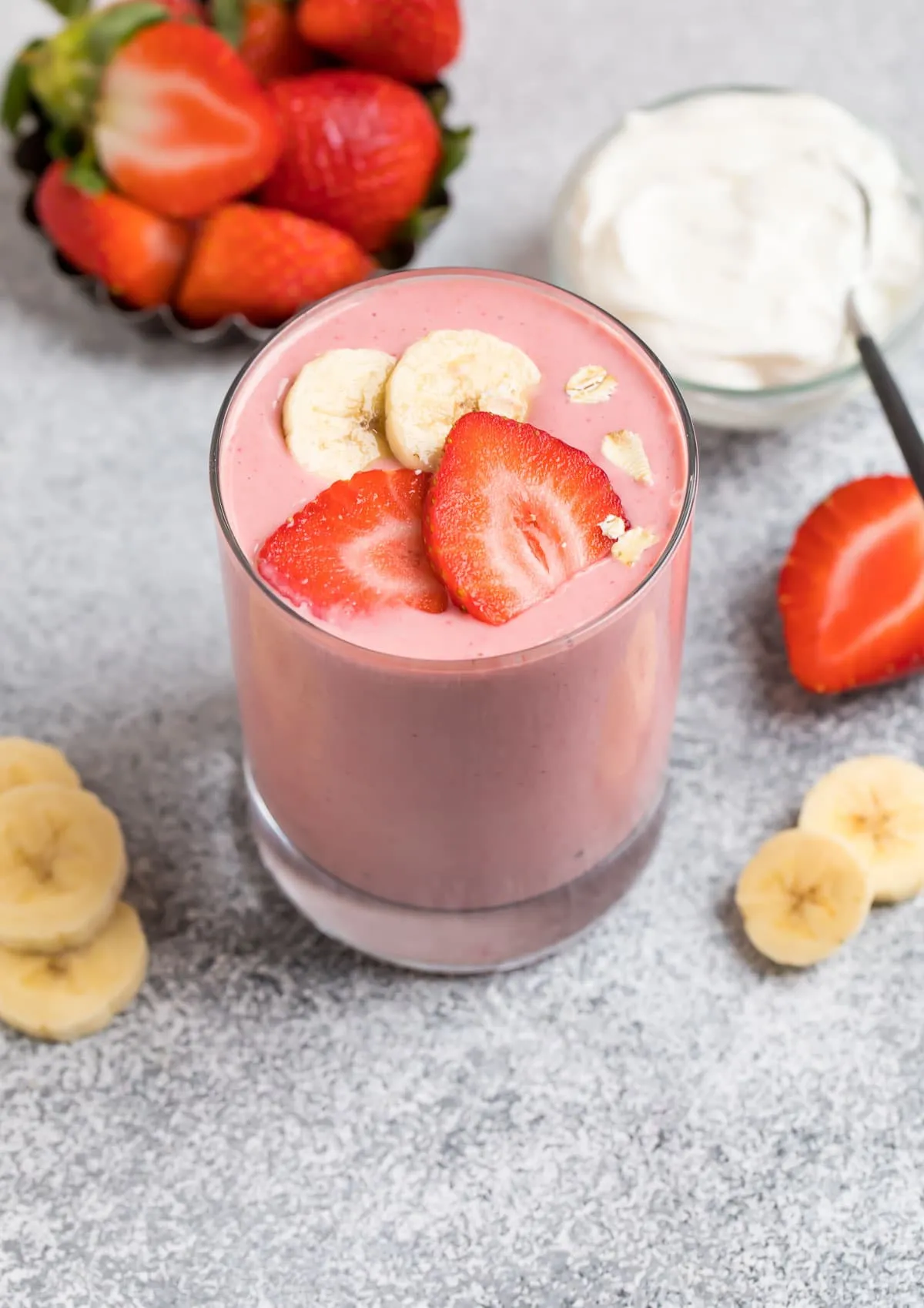 A healthy breakfast smoothie made with peanut butter, strawberries, and bananas